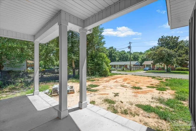 a view of an empty room with windows