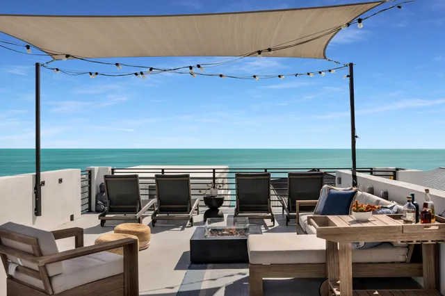 a front view of a house with glass windows