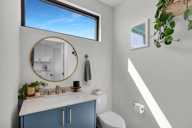 a view of a lake with couches chairs