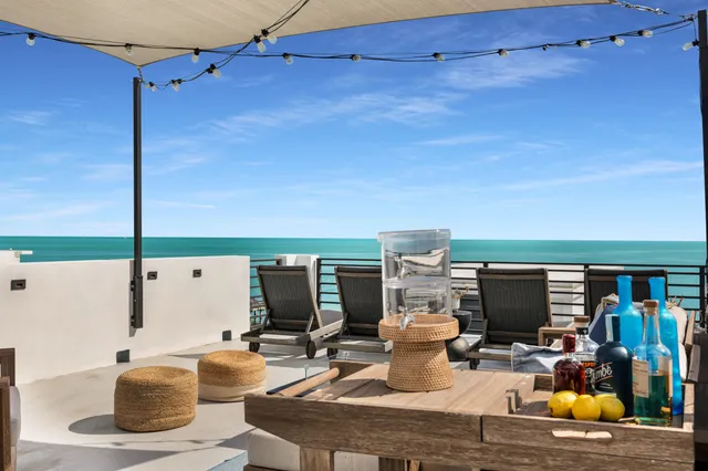 an aerial view of a house with a ocean view