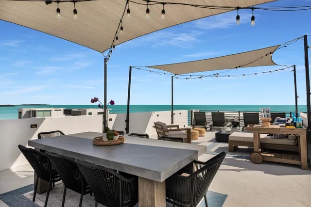 an aerial view of a house with a ocean view