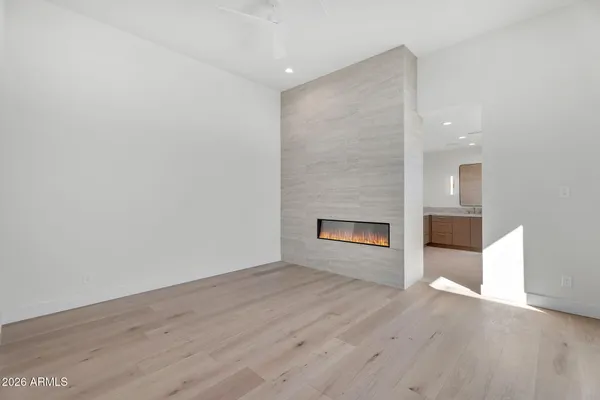 a bedroom with a bed and large window