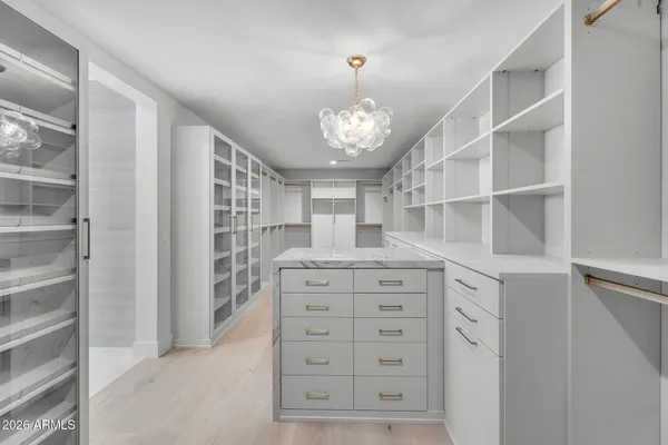 a spacious bathroom with a double vanity sink and a mirror