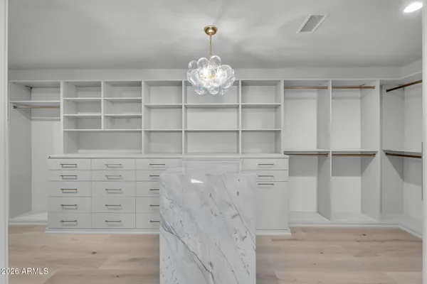 a bathroom with double vanity sinks and a mirror