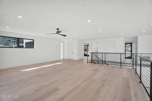 a bedroom with a large bed and a large window