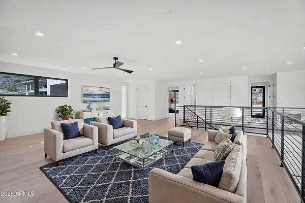 wooden floor in an empty room with a kitchen