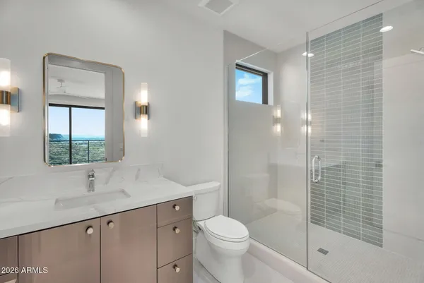a kitchen with white cabinets and a sink