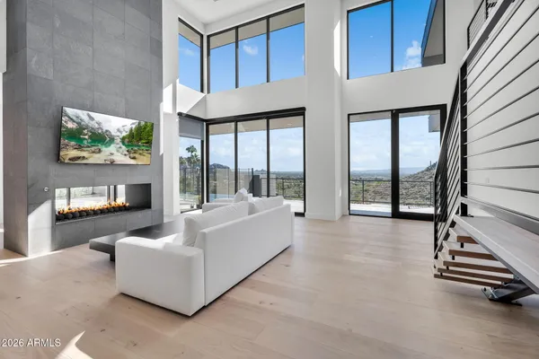 a living room with furniture and a large window