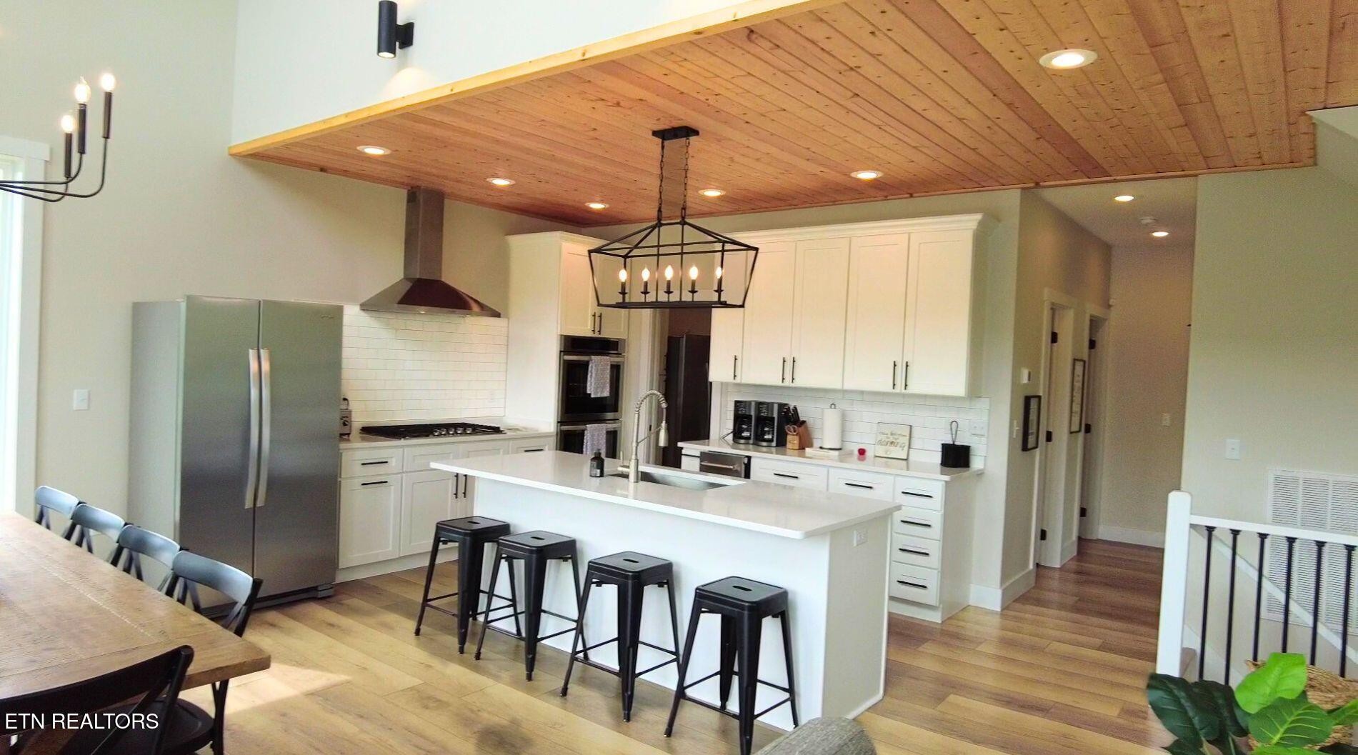 234 Cameron Loop Lane La Follette, TN 37766 - Photo 11 of 60 a kitchen with kitchen island granite countertop a sink a center island and stainless steel appliances