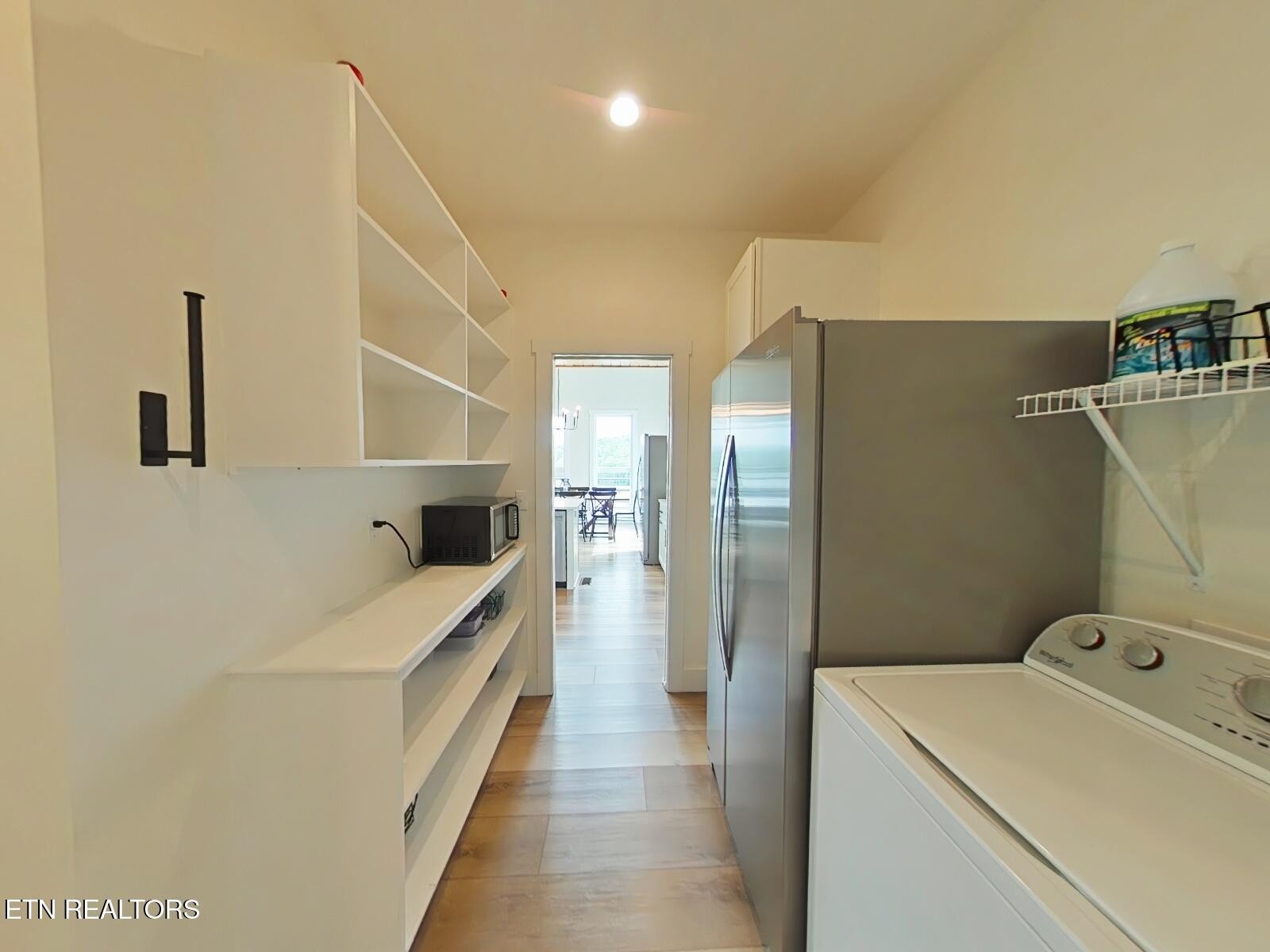 234 Cameron Loop Lane La Follette, TN 37766 - Photo 14 of 60 a bathroom with a sink a washer and dryer