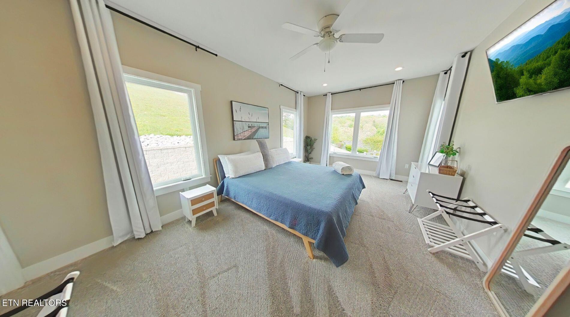 234 Cameron Loop Lane La Follette, TN 37766 - Photo 20 of 60 a living room with furniture a flat screen tv and a large window