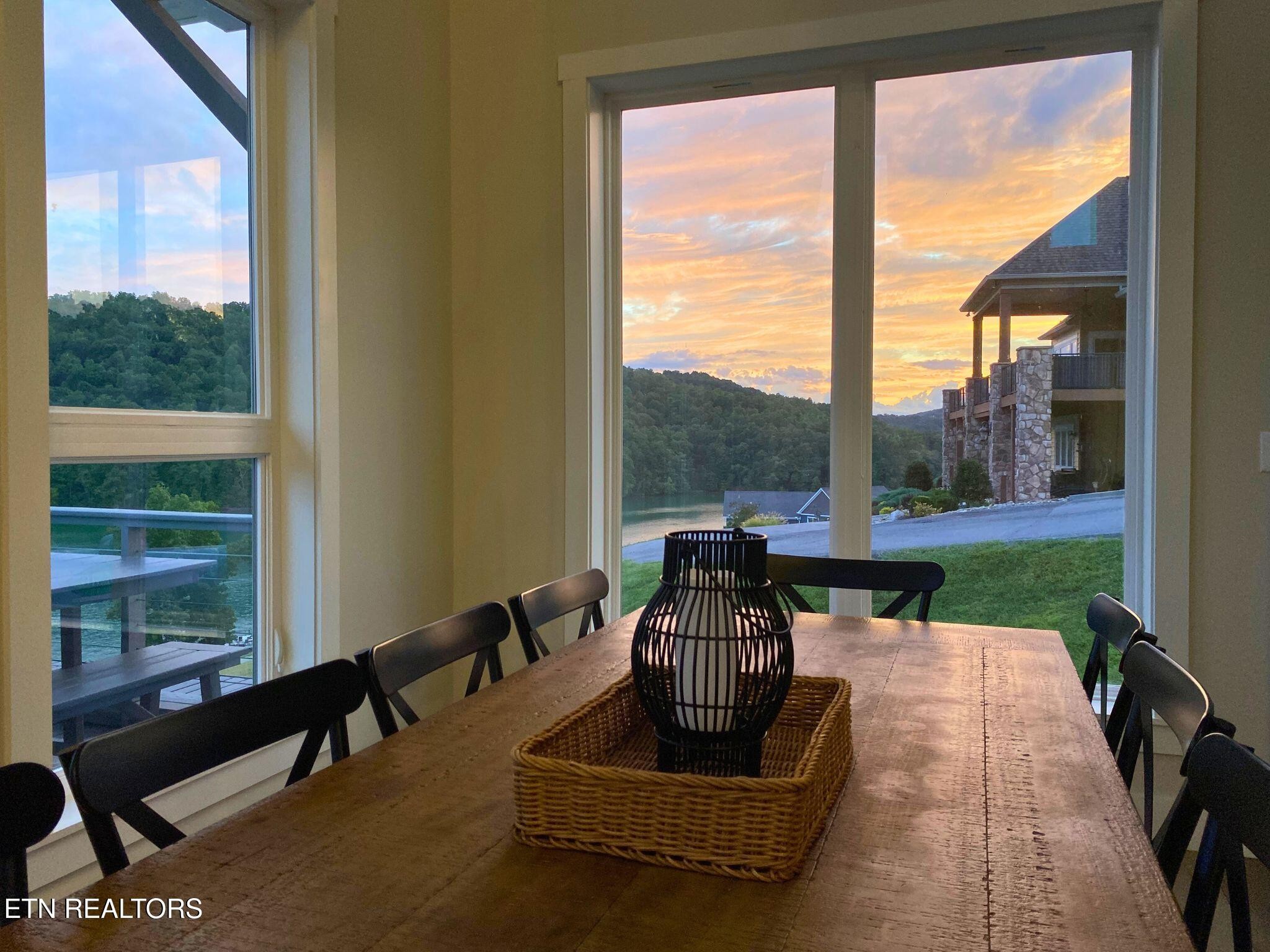 234 Cameron Loop Lane La Follette, TN 37766 - Photo 23 of 60 a living room with couch floor to ceiling window and a floor to ceiling window