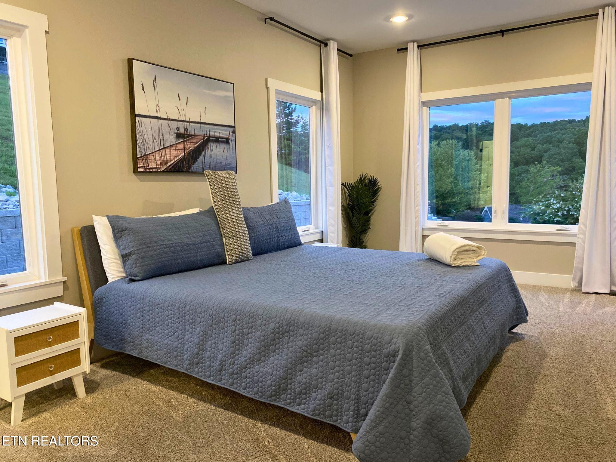 234 Cameron Loop Lane La Follette, TN 37766 - Photo 28 of 60 a bedroom with a large bed and a window