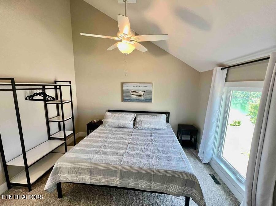 234 Cameron Loop Lane La Follette, TN 37766 - Photo 34 of 60 a bedroom with a bed and a large mirror