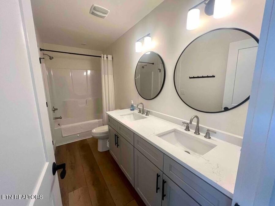 234 Cameron Loop Lane La Follette, TN 37766 - Photo 35 of 60 a bathroom with a double vanity sink mirror double and toilet