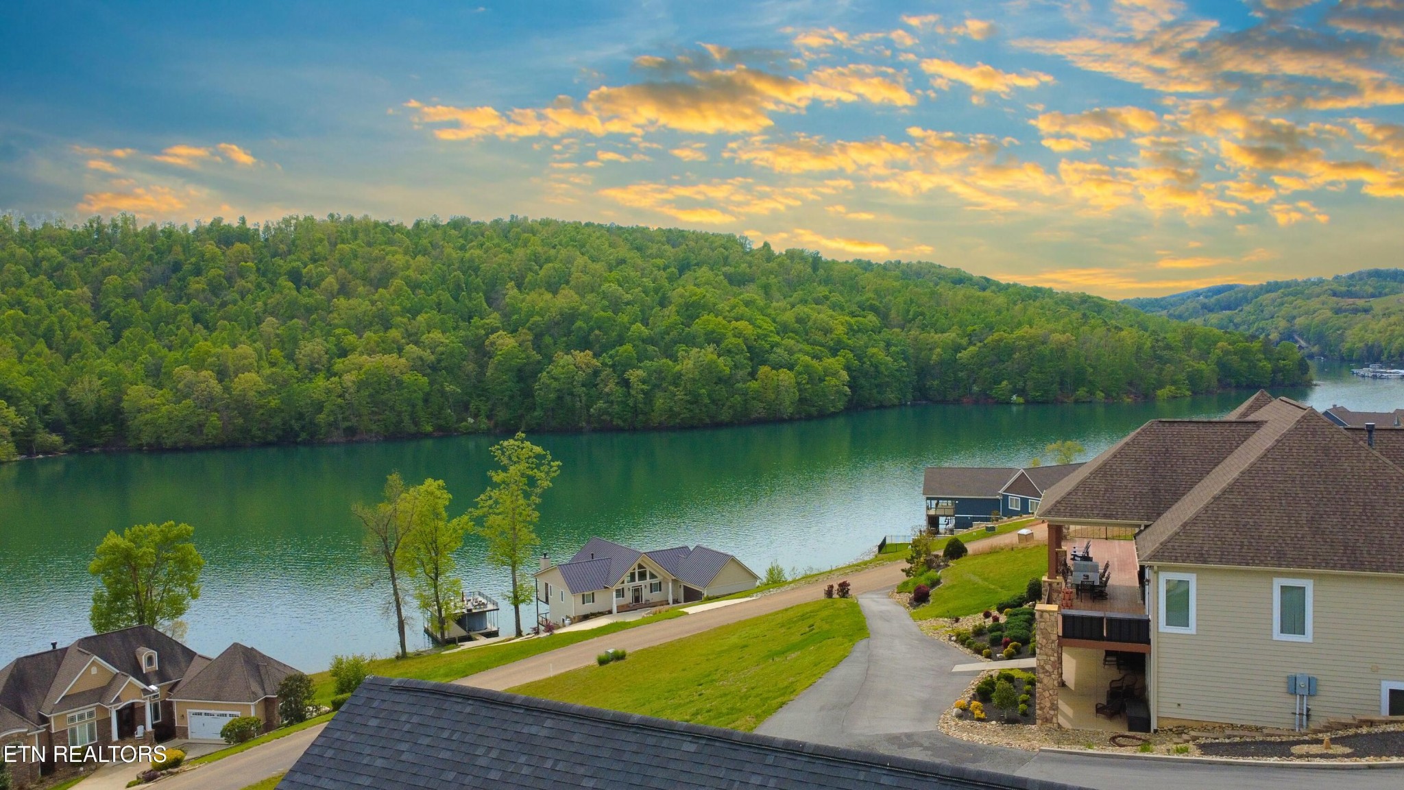 234 Cameron Loop Lane La Follette, TN 37766 - Photo 50 of 60 a view of a lake with a house in the background