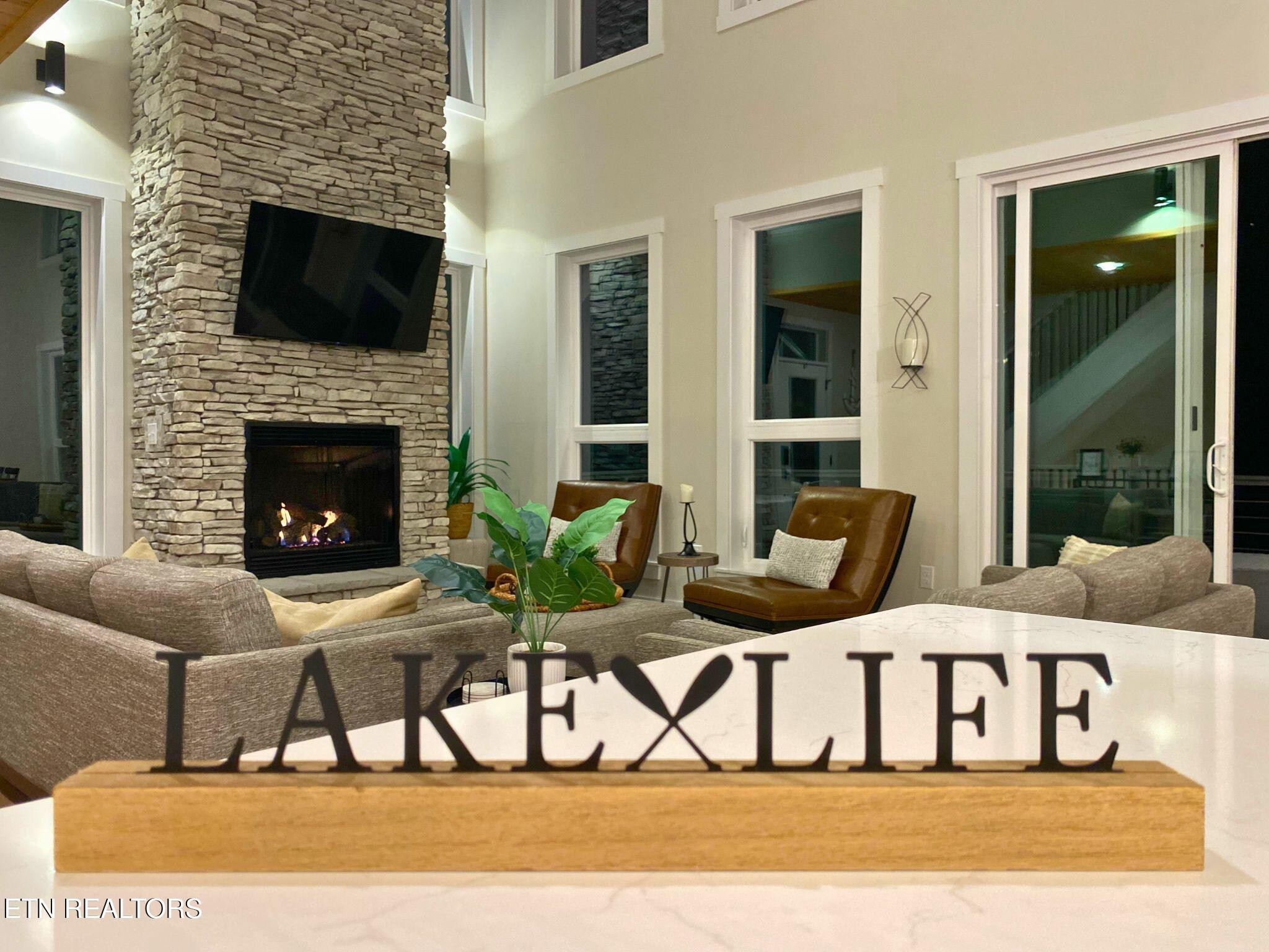 234 Cameron Loop Lane La Follette, TN 37766 - Photo 58 of 60 a living room with furniture and a fireplace