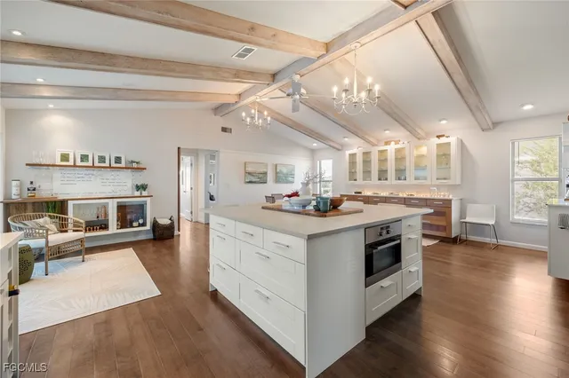 a kitchen with stainless steel appliances granite countertop a stove and a refrigerator