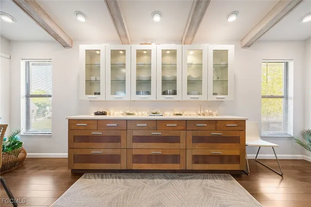 a kitchen with stainless steel appliances kitchen island granite countertop a stove and a refrigerator