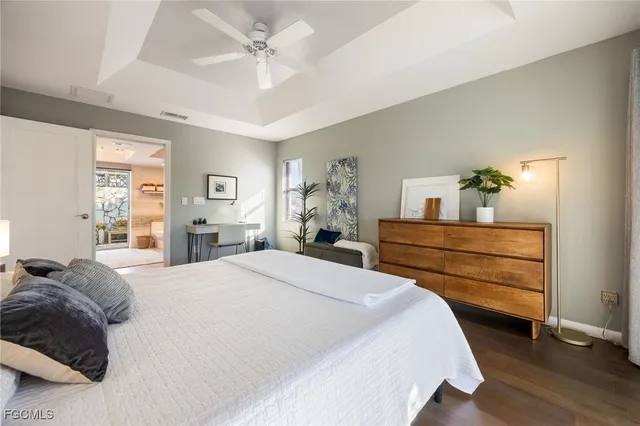 a bathroom with a tub sink mirror and shower