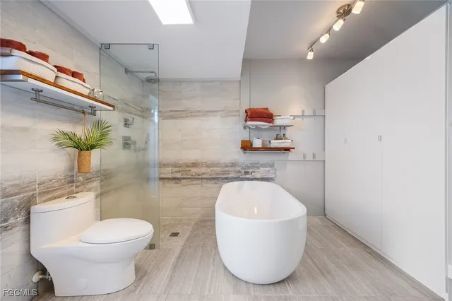 a outdoor sitting area with furniture and wooden floor