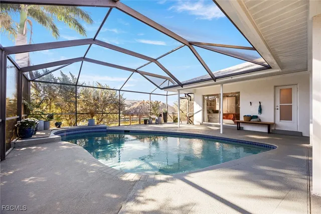 a view of a swimming pool with a patio