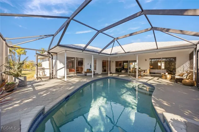 a view of a swimming pool with a patio