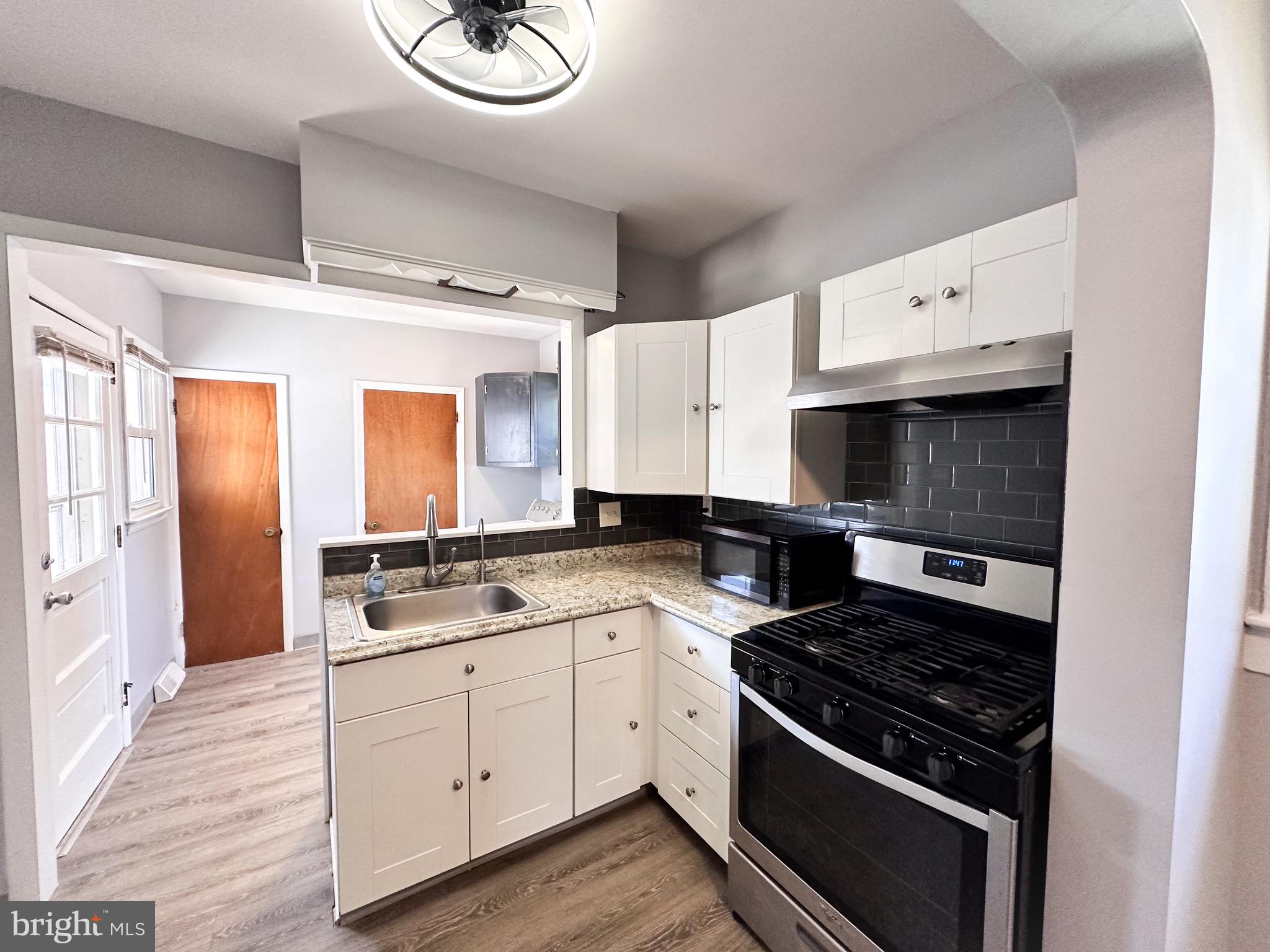 116 East Clinton Avenue Haddon Township, NJ 08107 - Photo 17 of 44 a kitchen with a stove and a sink