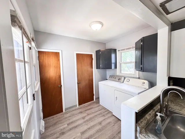a bathroom with a sink a mirror and a bathtub