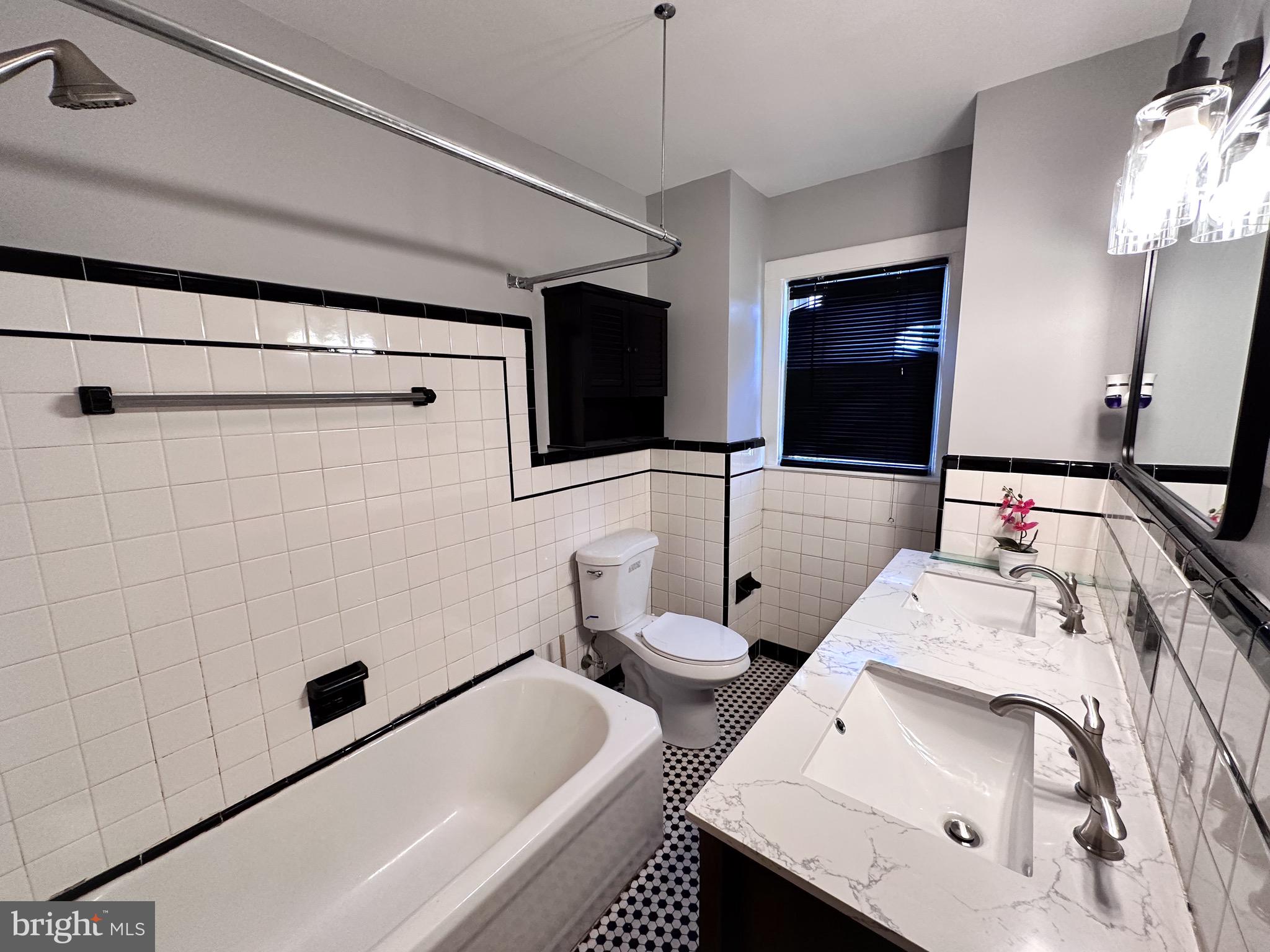 116 East Clinton Avenue Haddon Township, NJ 08107 - Photo 31 of 44 a bathroom with a sink a toilet and shower