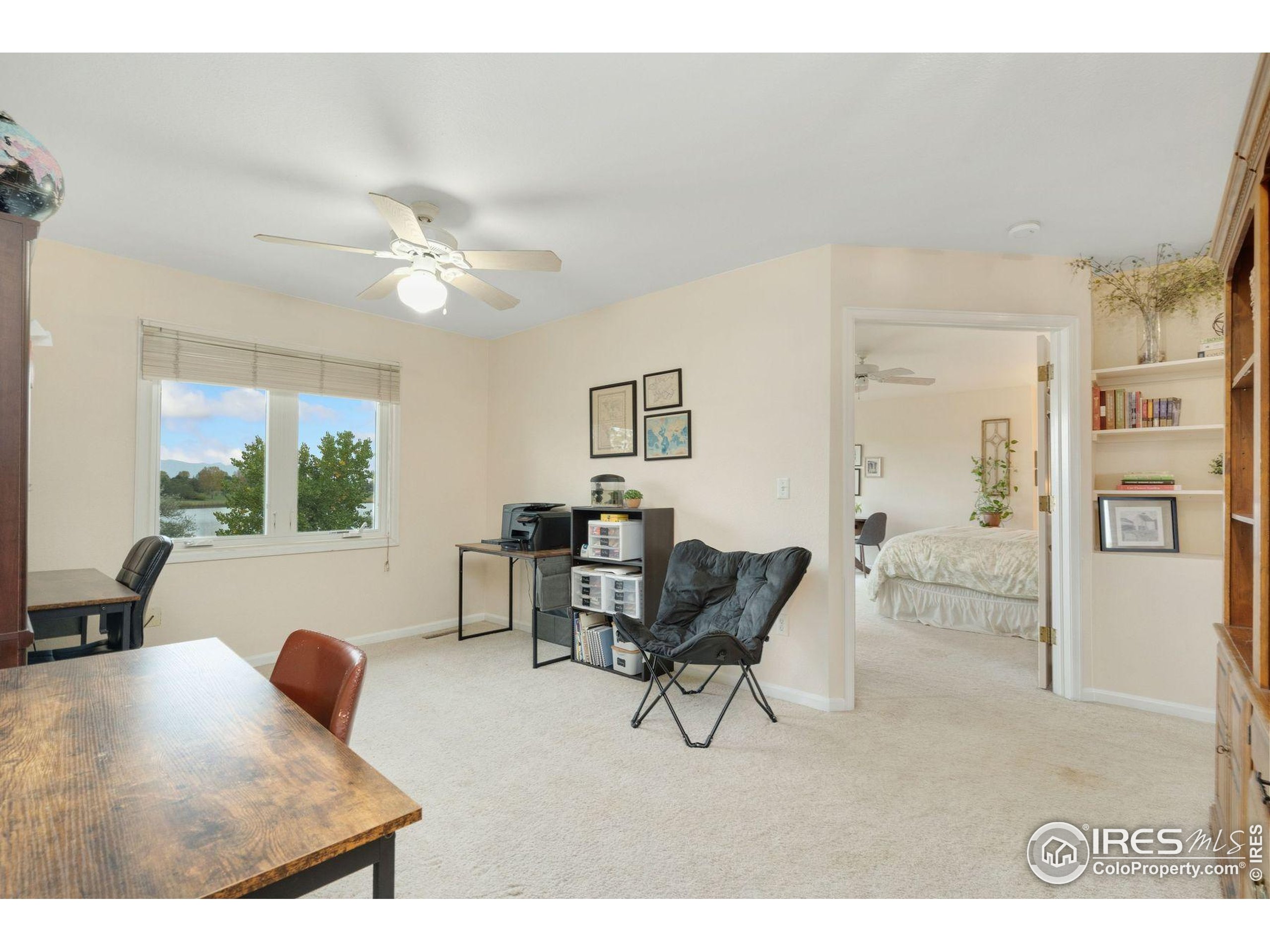 1055 Coho Run Fort Collins, CO 80524 - Photo 13 of 50 a living room with furniture and a large window