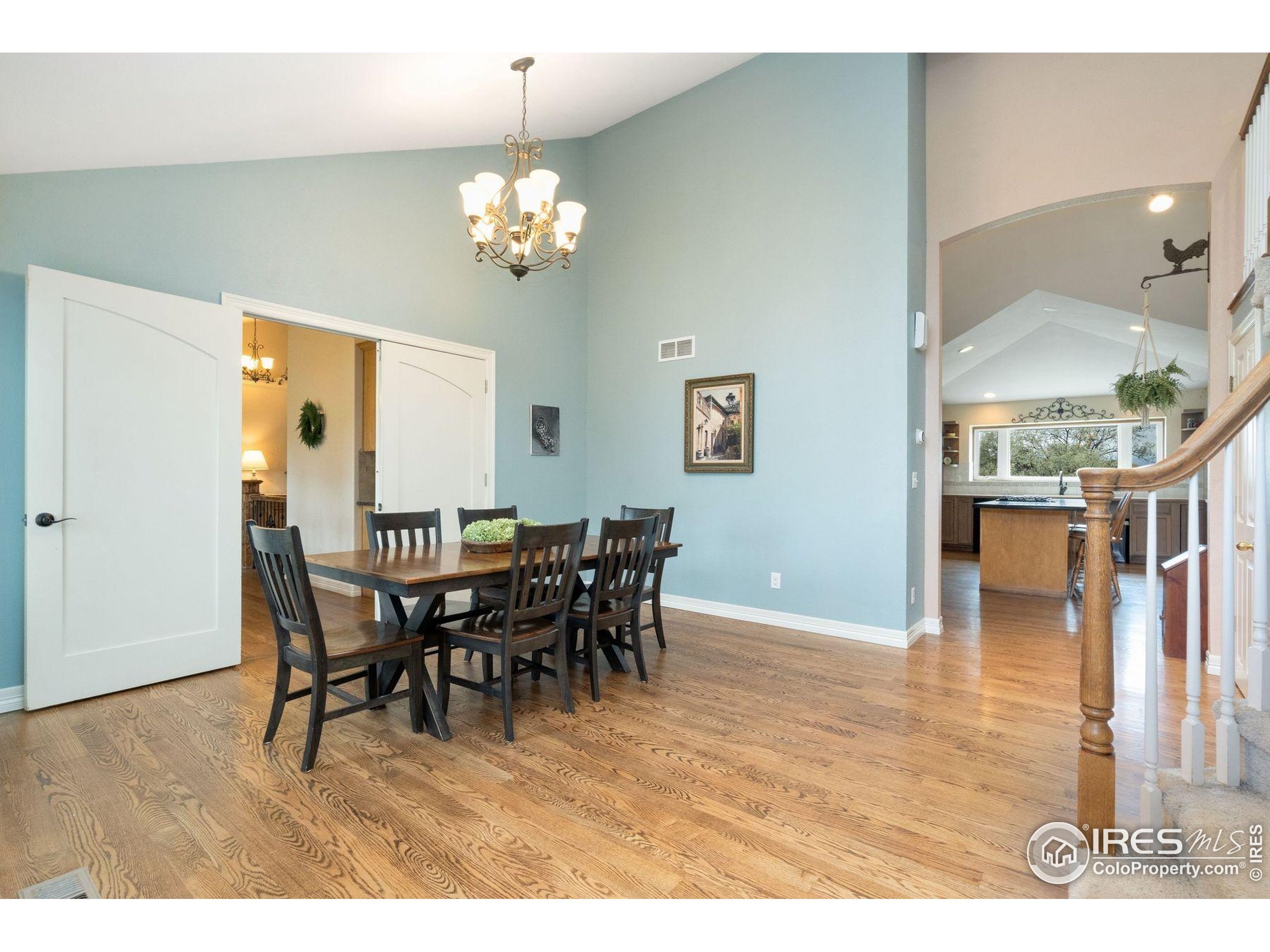 1055 Coho Run Fort Collins, CO 80524 - Photo 2 of 50 a view of a dining room with furniture and wooden floor