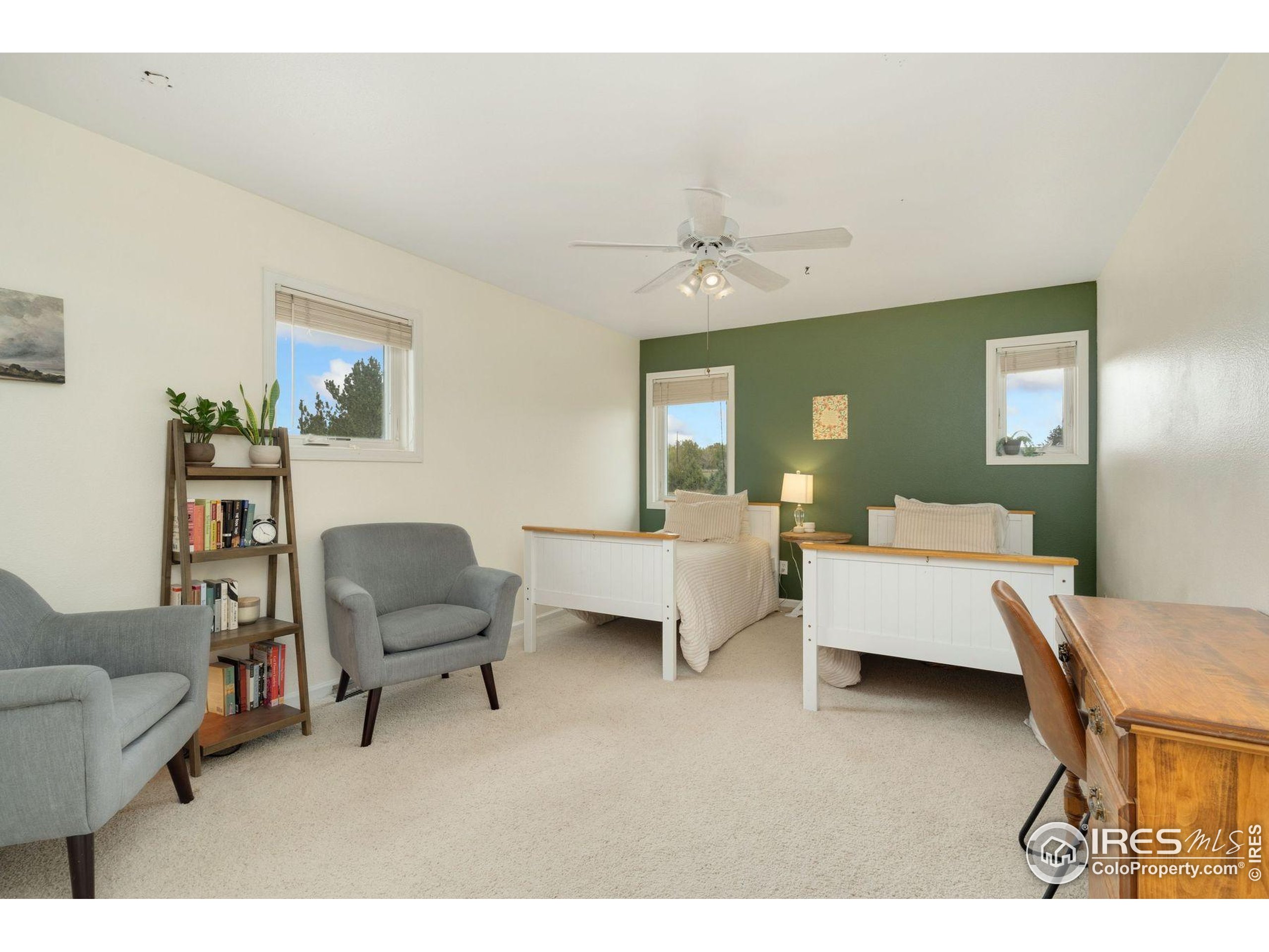 1055 Coho Run Fort Collins, CO 80524 - Photo 21 of 50 a living room with furniture and a wooden floor