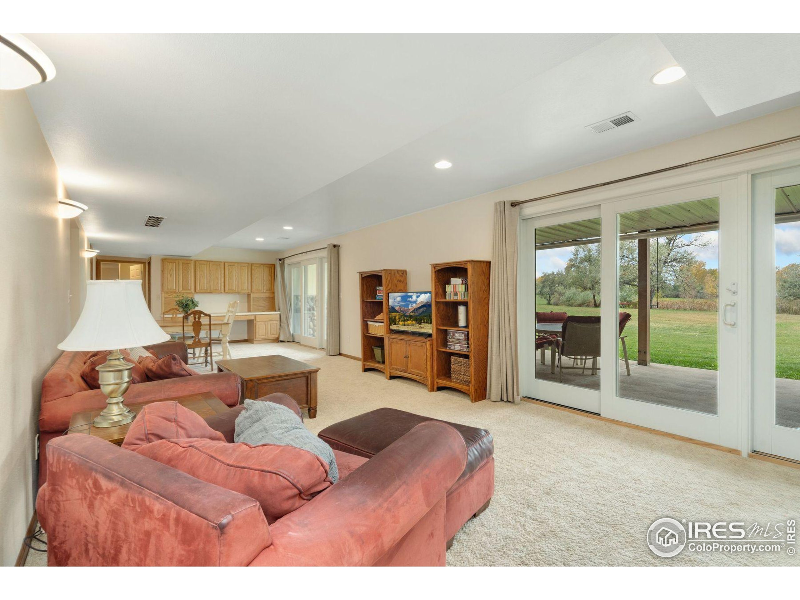 1055 Coho Run Fort Collins, CO 80524 - Photo 23 of 50 a living room with furniture and large window