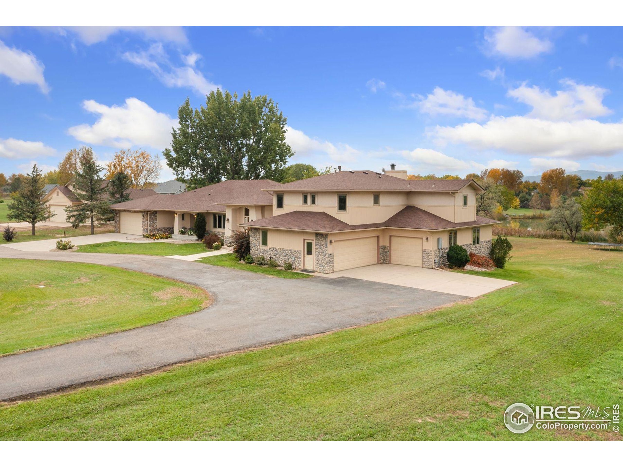 1055 Coho Run Fort Collins, CO 80524 - Photo 47 of 50 a swimming pool with outdoor seating and yard
