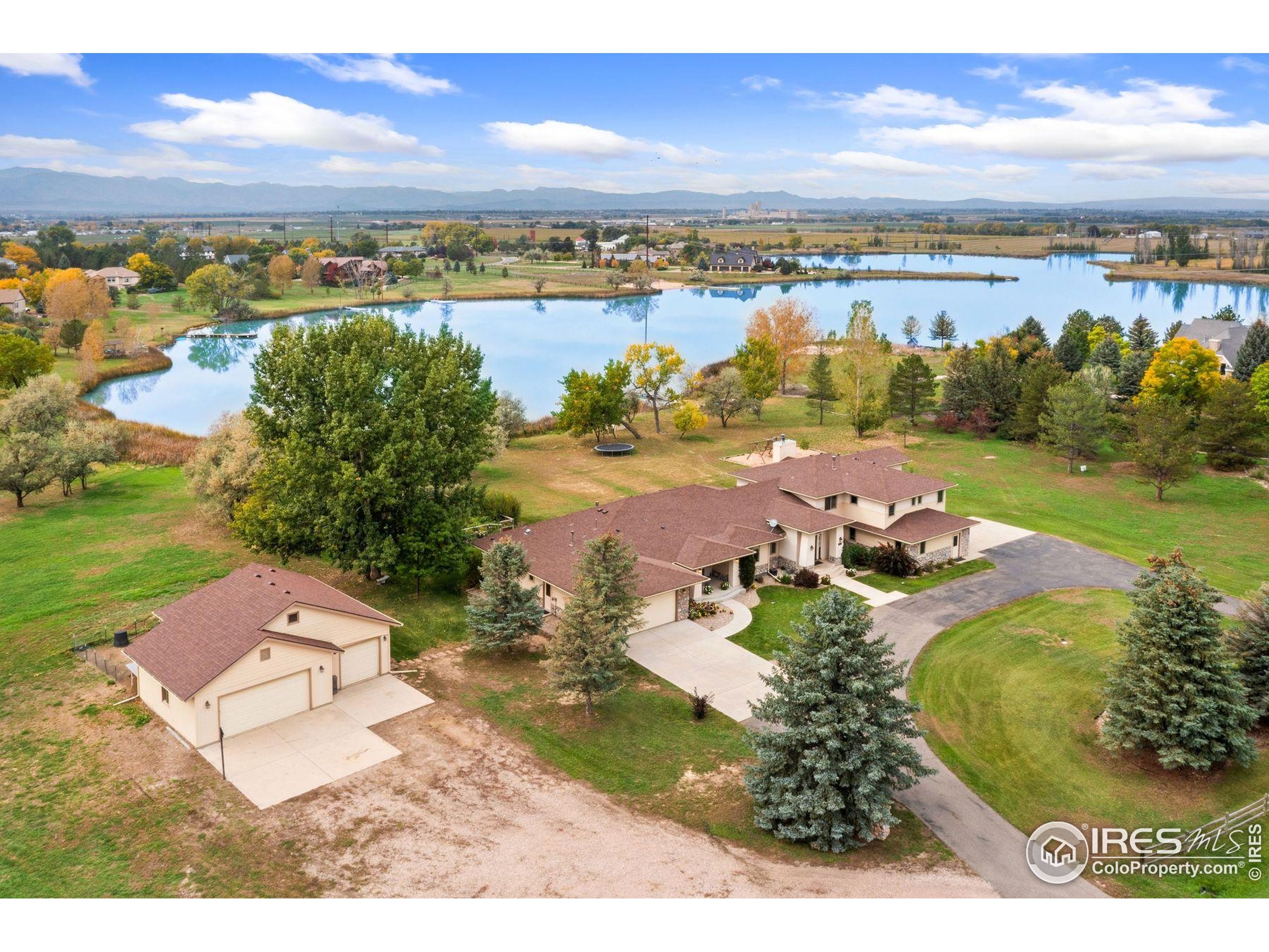 1055 Coho Run Fort Collins, CO 80524 - Photo 48 of 50 an aerial view of a house with a lake view