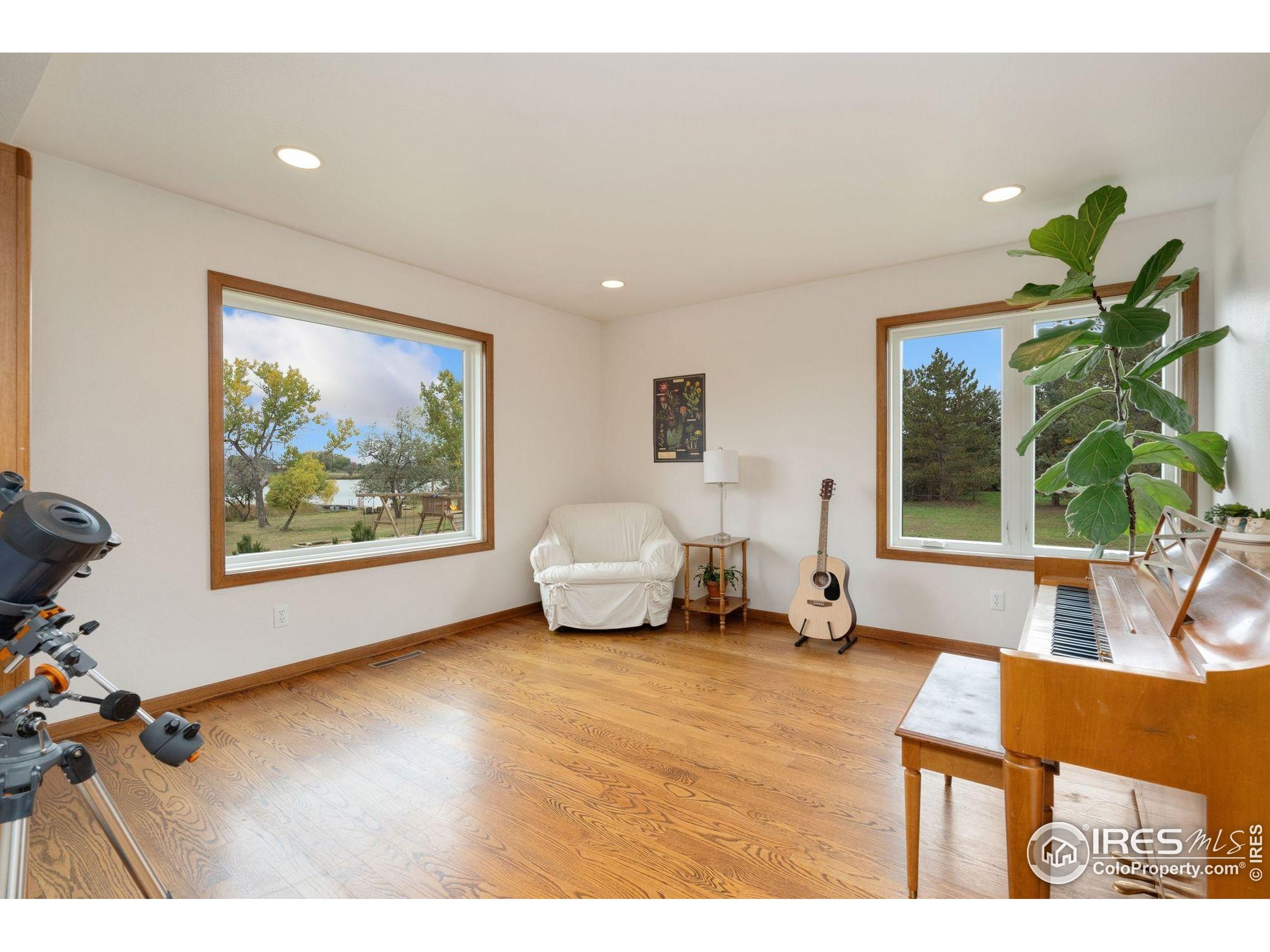 1055 Coho Run Fort Collins, CO 80524 - Photo 9 of 50 a living room with furniture and a large window