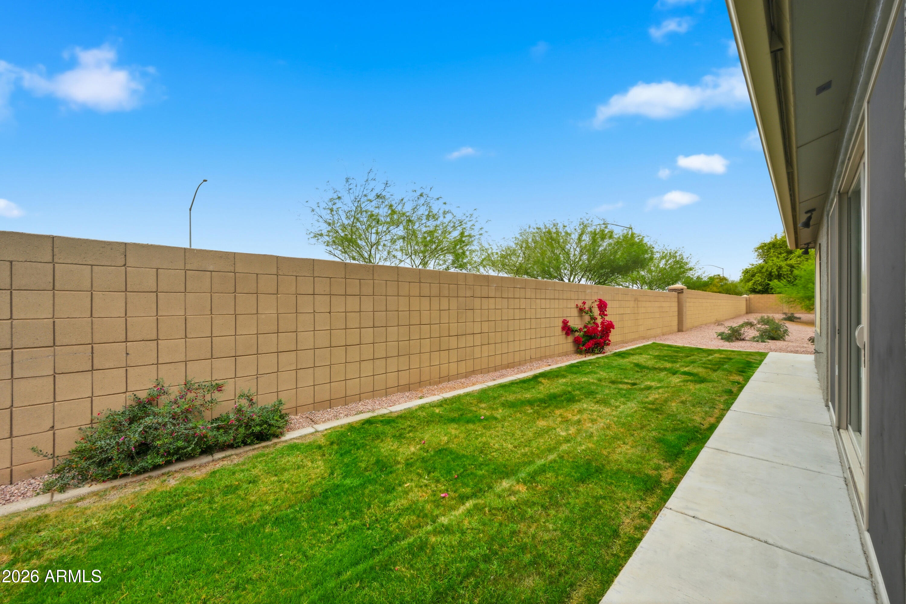 3117 South Signal Butte Road, Unit 476 Mesa, AZ 85212 - Photo 28 of 31 SC476 Back Grass Area 3