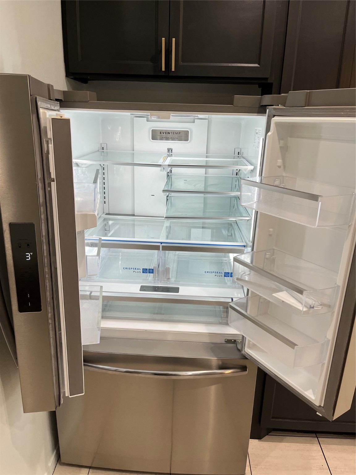 911 Chapwood Court Spring, TX 77373 - Photo 8 of 22 a refrigerator freezer sitting inside of a kitchen