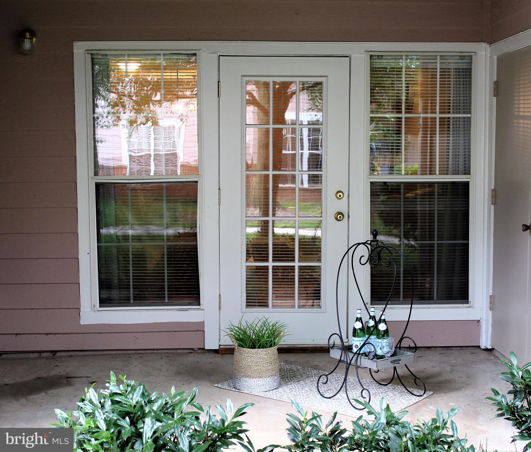 21023 Timber Ridge Terrace, Unit 103 Ashburn, VA 20147 - Photo 4 of 8 Covered Ground Level Patio w/Utility Closet