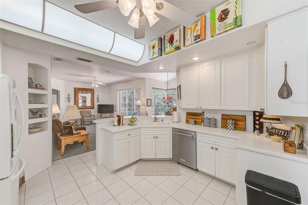 4 Poppy Court Homosassa, FL 34446 - Photo 13 of 55 a kitchen with cabinets and chairs