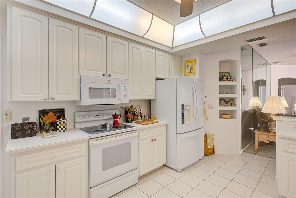 4 Poppy Court Homosassa, FL 34446 - Photo 16 of 55 a kitchen with cabinets and appliances