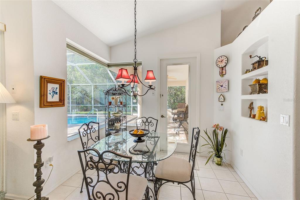 4 Poppy Court Homosassa, FL 34446 - Photo 18 of 55 a view of a dining room with furniture and a chandelier