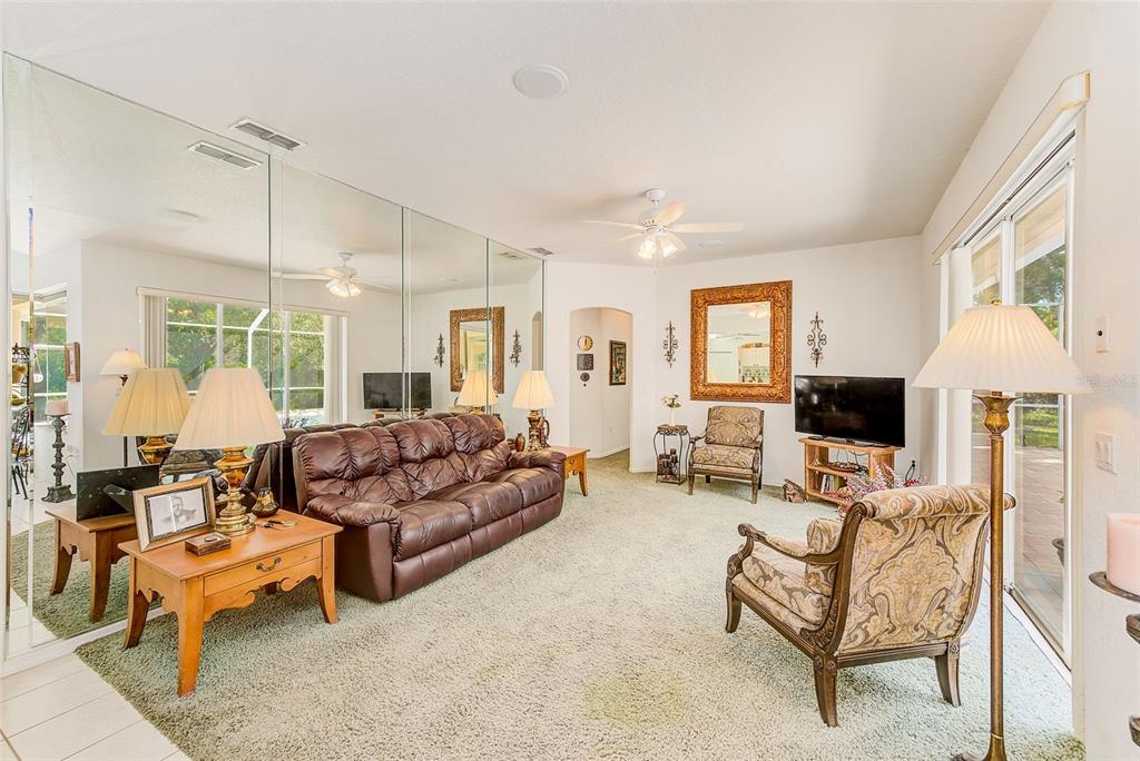 4 Poppy Court Homosassa, FL 34446 - Photo 20 of 55 a living room with furniture and a flat screen tv