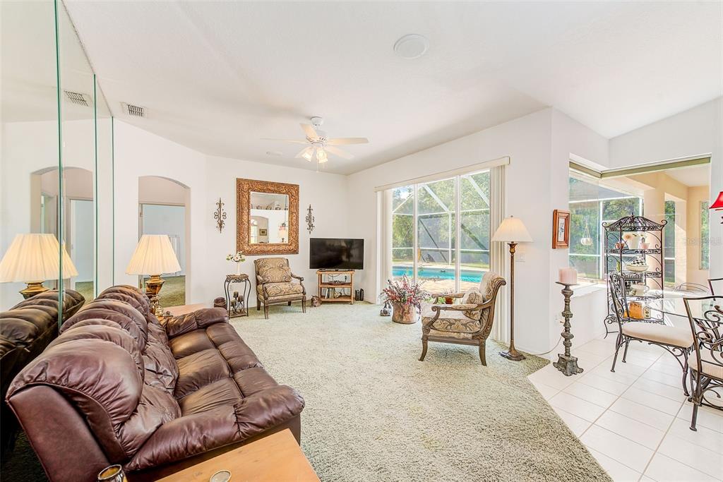 4 Poppy Court Homosassa, FL 34446 - Photo 21 of 55 a living room with furniture and a large window