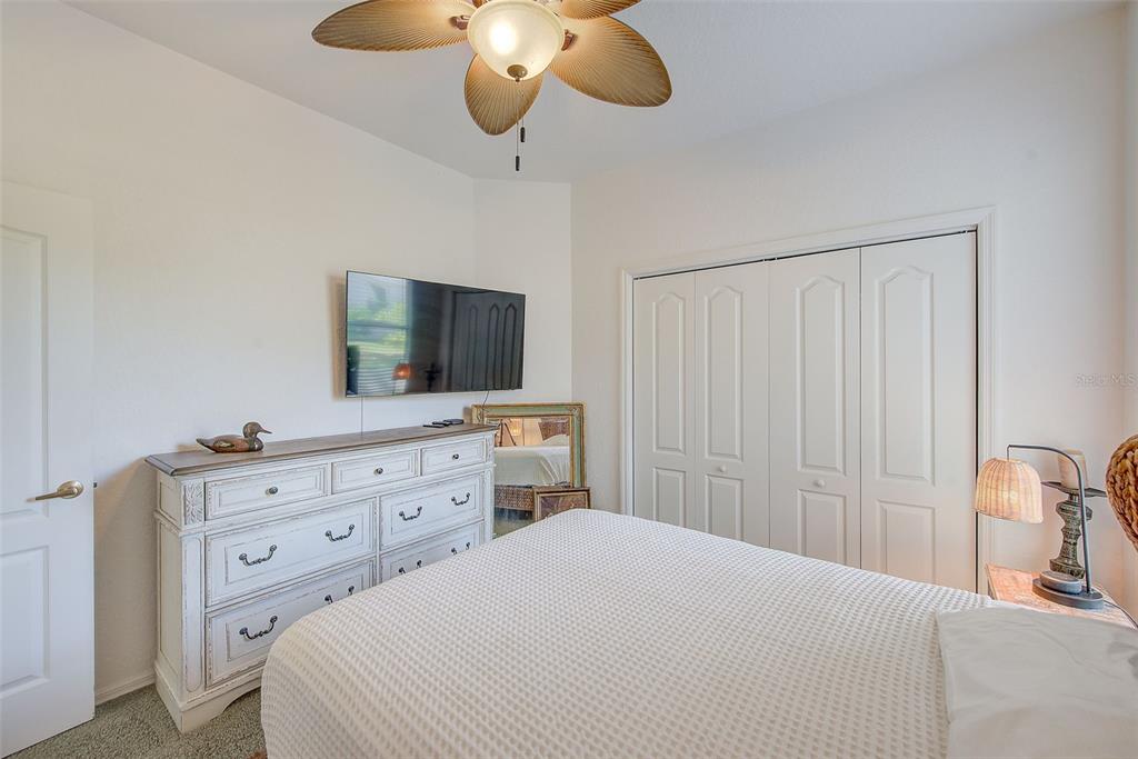 4 Poppy Court Homosassa, FL 34446 - Photo 31 of 55 a bedroom with a bed and a flat screen tv