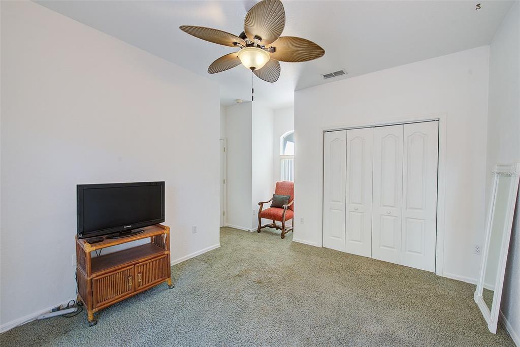 4 Poppy Court Homosassa, FL 34446 - Photo 33 of 55 a living room with furniture and a flat screen tv