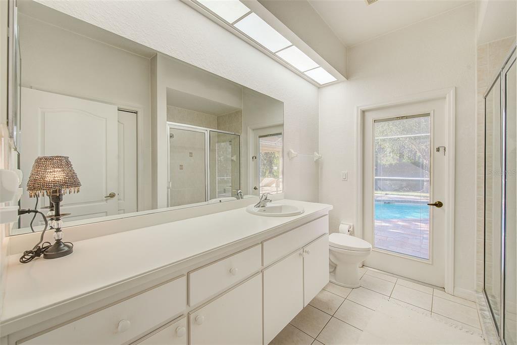 4 Poppy Court Homosassa, FL 34446 - Photo 34 of 55 a en suite bathroom with a sink and a mirror