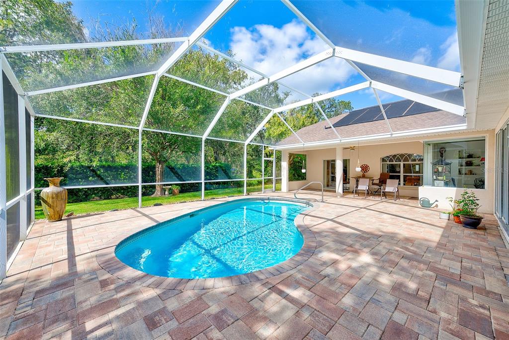 4 Poppy Court Homosassa, FL 34446 - Photo 44 of 55 a view of a house with backyard pool and sitting area