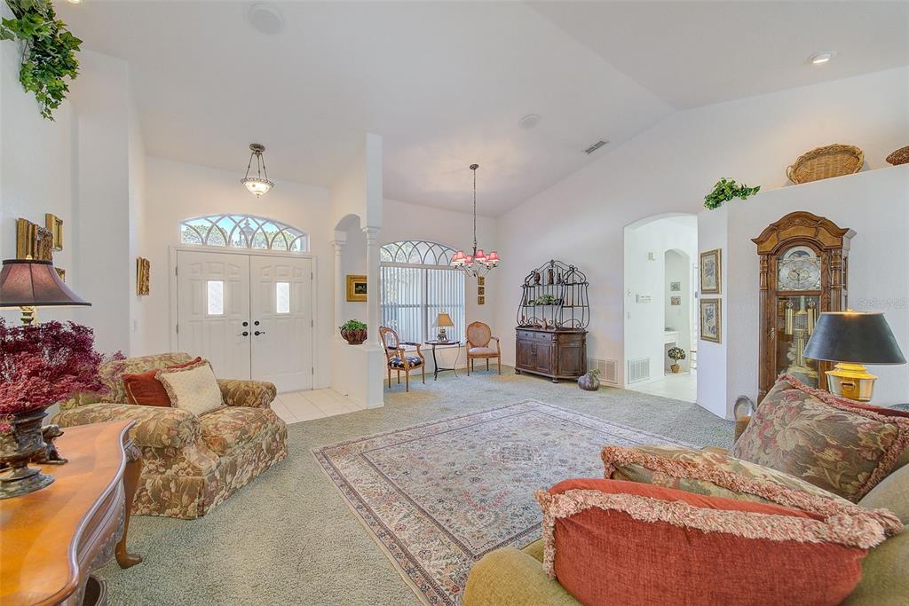 4 Poppy Court Homosassa, FL 34446 - Photo 6 of 55 a living room with furniture and a chandelier